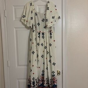 BloomChic Cream Maxi Dress with Blue and Red Floral Design